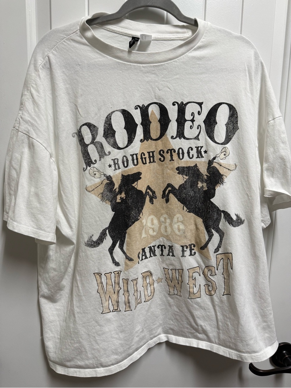 Divided White Rodeo Graphic Tee with Black and Tan Print